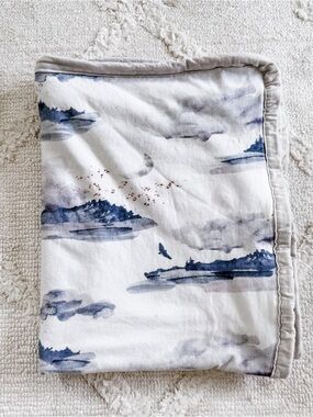 Oilo Studio White and Blue Watercolor Island Baby Throw